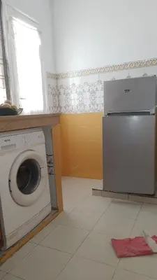 a laundry room with a washing machine and a window at Paradise house in Casablanca