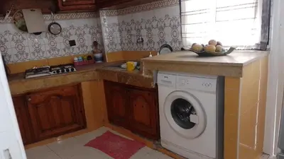 a kitchen with a washing machine in a kitchen at Paradise house in Casablanca