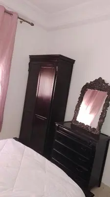 a bedroom with a bed and a mirror on a dresser at Paradise house in Casablanca
