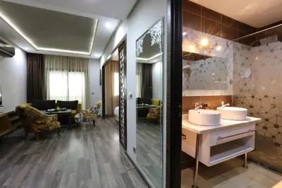 a bathroom with two sinks and a large mirror at Silver Suites Hotel & Spa Casablanca in Casablanca
