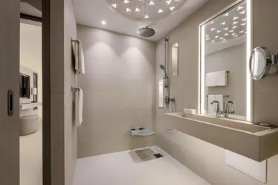 a bathroom with a sink and a mirror at Rabat Marriott Hotel in Rabat