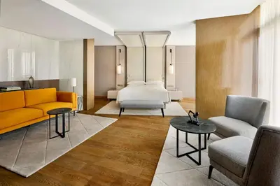 a living room with a bed and a couch at Rabat Marriott Hotel in Rabat