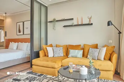 a living room with a couch and a table at Stayhere Casablanca - Palmier - Executive Residence in Casablanca