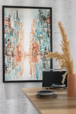 a painting on a wall next to a table with plates at Gauthier Living by ShortStayMaroc, Appartement Équipé, Centre, 1 ou 2 Chambres in Casablanca