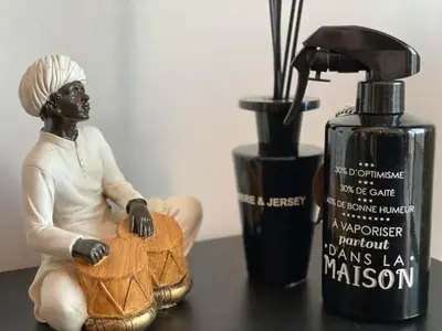 a statue of a woman sitting next to a bottle of mascara at Anfa Living 23-BREATHTAKING SEA VIEW NEW&CHIC 5 in Casablanca