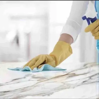 a person using a pair of gloves to clean a counter at Anfa Living 11 - Classy & Élégant near the Sea in Casablanca