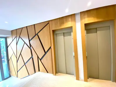 a row of four doors in a room with wood at Anfa Living 11 - Classy & Élégant near the Sea in Casablanca