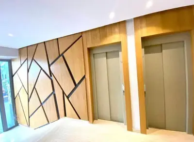 a row of doors in a building with a wall at Anfa Living 29-The Gatsby 5 Chic&New Apt near Sea in Casablanca