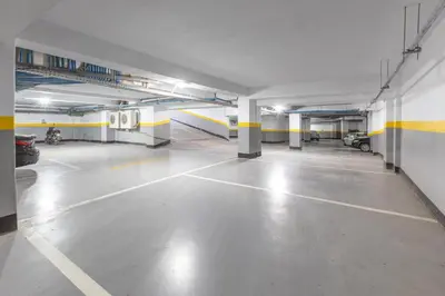 an empty parking garage with cars parked in it at ANFA LIVING - Front Sea VIEW 180 -2 or 3 bedrooms- LES TERRASSES D'ANFA by ShortStayMaroc in Casablanca