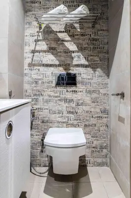 a bathroom with a toilet and a brick wall at Metropolitan 19- 2 BEDROOMS with terrace NEW&SUNNY in Casablanca