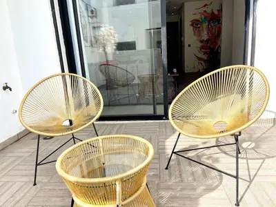 a couple of chairs sitting in front of a store at Metropolitan 19- 2 BEDROOMS with terrace NEW&SUNNY in Casablanca