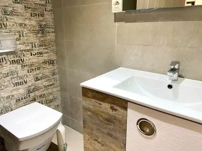 a bathroom with a white sink and a toilet at Metropolitan 19- 2 BEDROOMS with terrace NEW&SUNNY in Casablanca