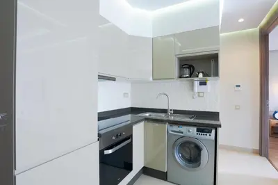 a kitchen with a washing machine and a sink at #34 New Flat in new Garden Residence in Casablanca