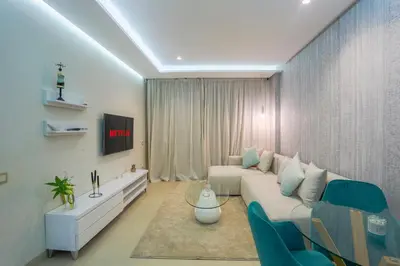 a living room with a couch and a table at #34 New Flat in new Garden Residence in Casablanca