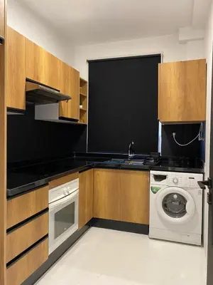 a kitchen with a washing machine and a washer at RABAT Residence - OCEAN STAY in Rabat