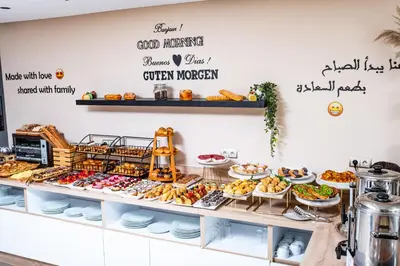 a bakery with a variety of food items on display at Family Aparthotel in Casablanca