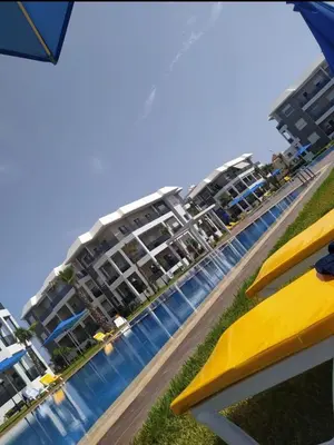 a view of a hotel from the beach at Bel Appartement à AMWAJ Sidi rahal in Casablanca