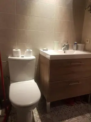 a bathroom with a toilet and a sink at Sidi Rahal , Residence Garden Beach 2 in Sidi Rahal