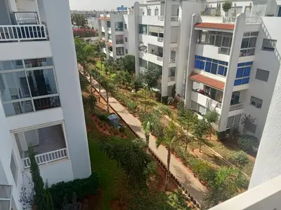 an aerial view of an apartment complex with palm trees at luxu appart siesta beach resort in Mohammedia