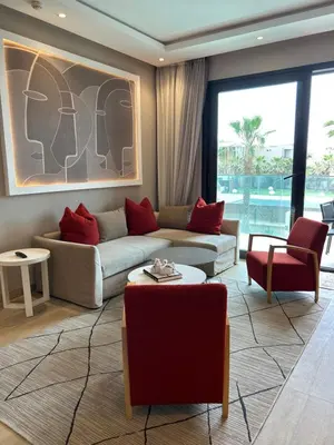 a living room with a couch and red pillows at Anfa Place, Art Deco Luxury Apartment, Sunny Ocean View in Casablanca
