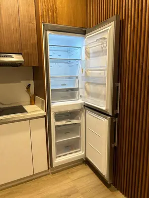 an empty refrigerator with its door open in a kitchen at Anfa Place, Art Deco Luxury Apartment, Sunny Ocean View in Casablanca