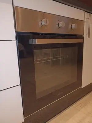 a microwave oven sitting inside of a kitchen at La Gironde - Sweet Home - Casablanca in Casablanca