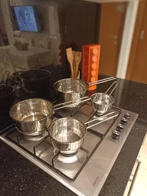 a group of bowls sitting on top of a stove at La Gironde - Sweet Home - Casablanca in Casablanca