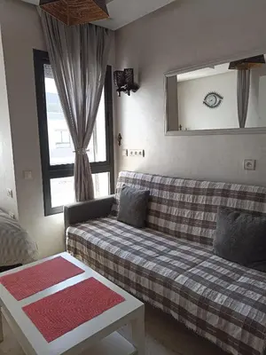 a living room with a couch and a window at La Gironde - Sweet Home - Casablanca in Casablanca