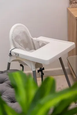 a white chair in a room with a plant at Airport Apartment Suite Casablanca FREE WIFI Modern Confort Calme in Derroua