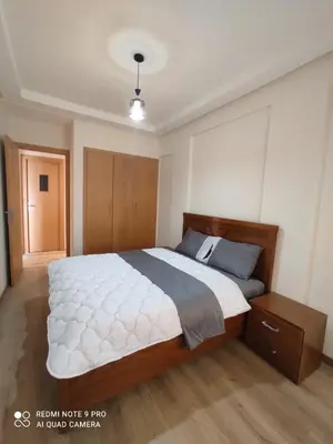 a bedroom with a large bed in a room at Apartment place italie in Rabat
