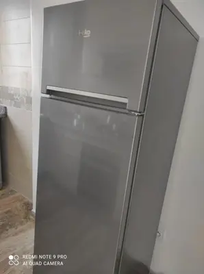 a stainless steel refrigerator in a kitchen at Apartment place italie in Rabat