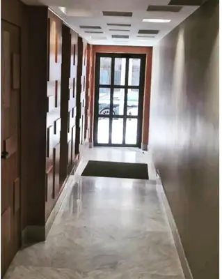 a hallway with a large window and a room with a floor at Appartement haut standing au quartier les princesses avec grande terrasse et parking gratuit in Casablanca
