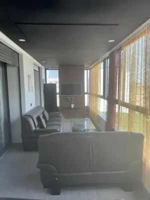 a living room with a couch and a table at Future apartments in Casablanca