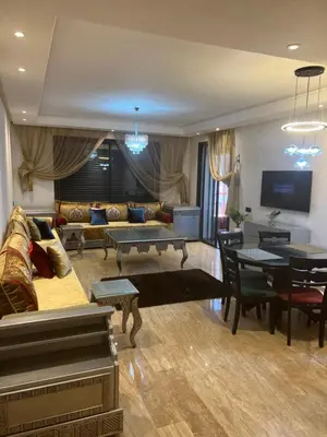 a living room with a couch and a table at Future apartments in Casablanca