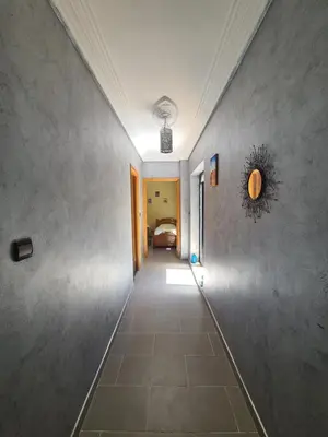 a hallway leading to a room with a bed at Dar Babou in Rabat