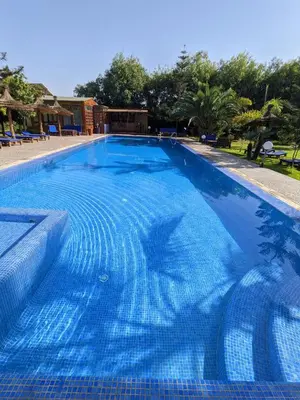 a large swimming pool with blue water at Mesdunes in Azemmour