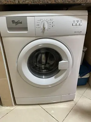 a washing machine with its door open in a kitchen at Échappez à la ville , Appartement près de la nature, entre forêt et plage juste pour les familles in Skhirat