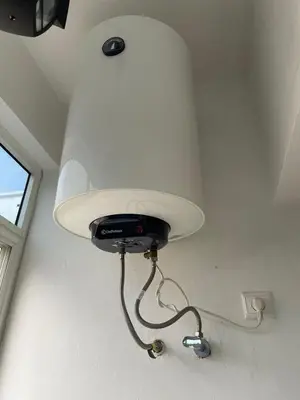 a light hanging from the ceiling in a room at Échappez à la ville , Appartement près de la nature, entre forêt et plage juste pour les familles in Skhirat