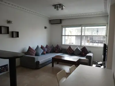 a living room with a couch and a table at Gauthier confort in Casablanca