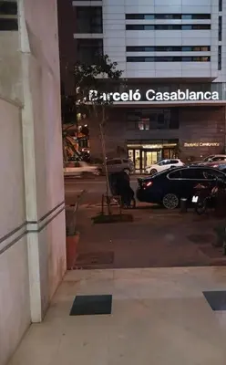a building with a car parked in a parking lot at Gauthier confort in Casablanca
