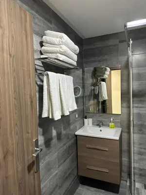 a bathroom with a sink and a mirror at Central Park House - 70m² in Mohammedia