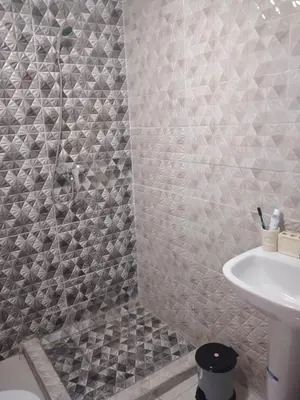 a bathroom with a shower and a sink at La Perle in Casablanca