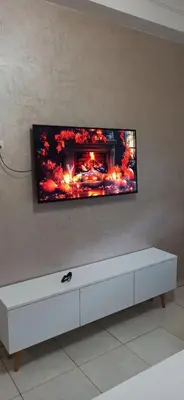 a flat screen tv hanging on a wall at La Perle in Casablanca