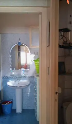a bathroom with a sink and a mirror at Agdal Rabat in Rabat