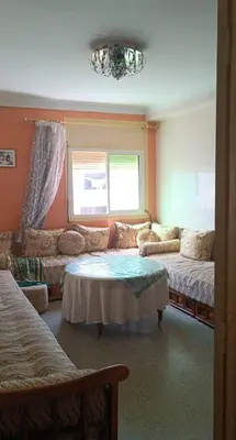 a living room with a couch and a table at Agdal Rabat in Rabat