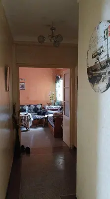 a hallway of a living room with a couch and a table at Agdal Rabat in Rabat