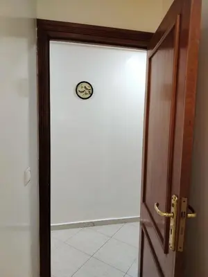a door with a clock on top of it at Appartement 11 Casa Voyageurs in Casablanca