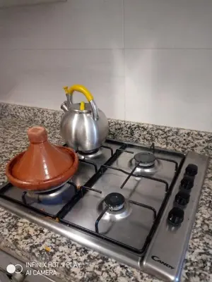 a tea kettle sitting on top of a stove at Belfakih in Beni Brour