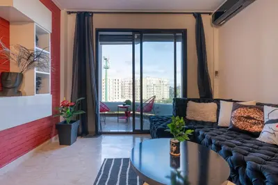 a living room with a couch and a table at La cascade de Maryline in Casablanca