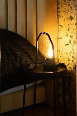 a lamp sitting on a table next to a bed at Le Vintage Dead Sea in Casablanca